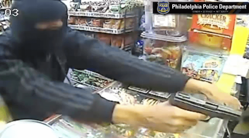 Tattooed robber grabbed grocery cash