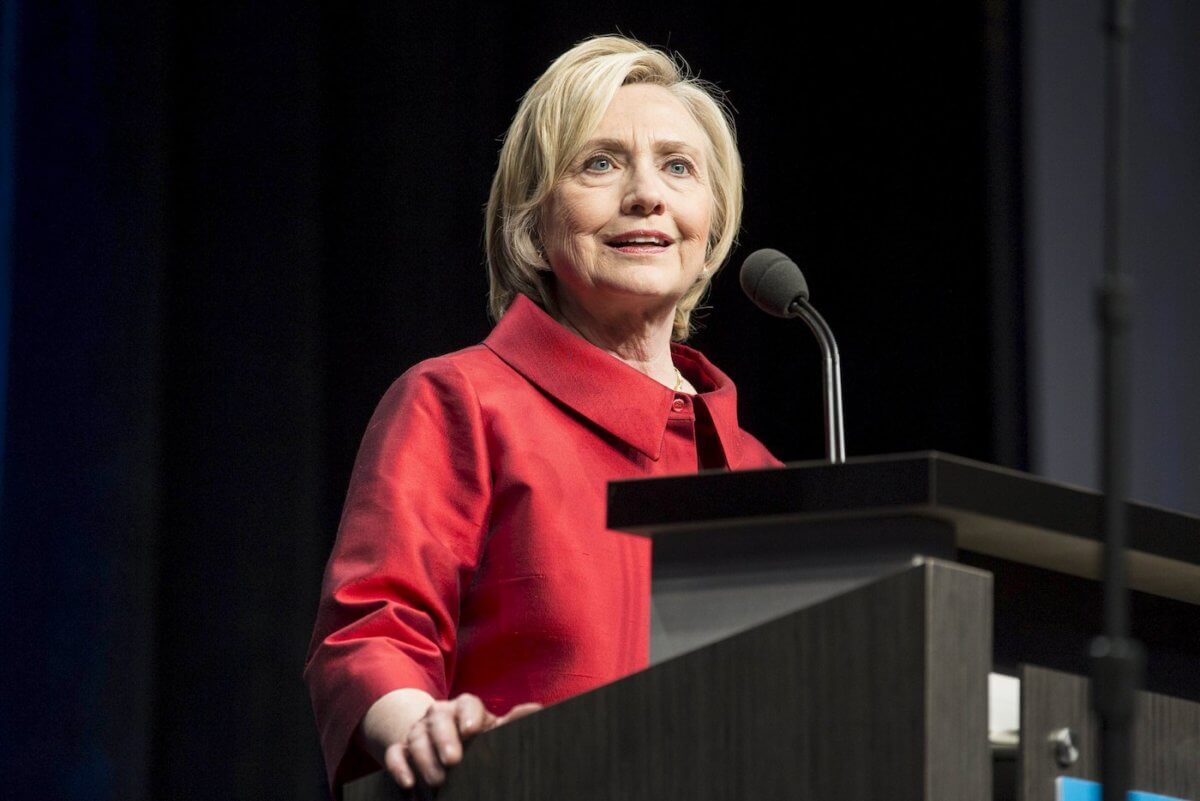 Clinton to propose tax incentives to encourage companies to share profits:
