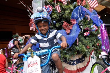 PHOTOS: Christmas in July for Philly youth at Philly POPS bike event
