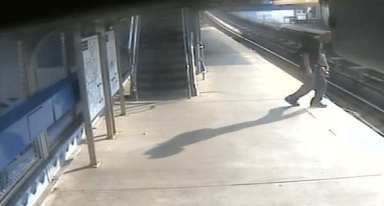 VIDEO: SEPTA police help man who has fallen on train tracks