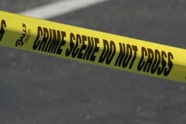 Woman shot in head outside residence