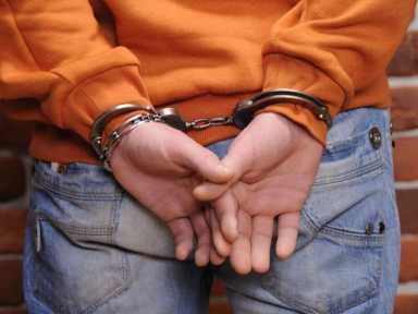 Man held on $100k bail on charges he tried to run over his neighbor, twice