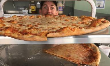 A pizza chef in Pizza Dads, the new shop from the minds behind Pizza Brain, which opened April 1 in Brewerytown. Credit: Sam Newhouse