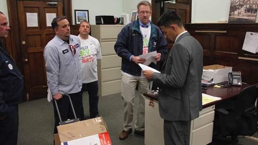 Soda tax opponents bring 18K petitions to Kenney’s office
