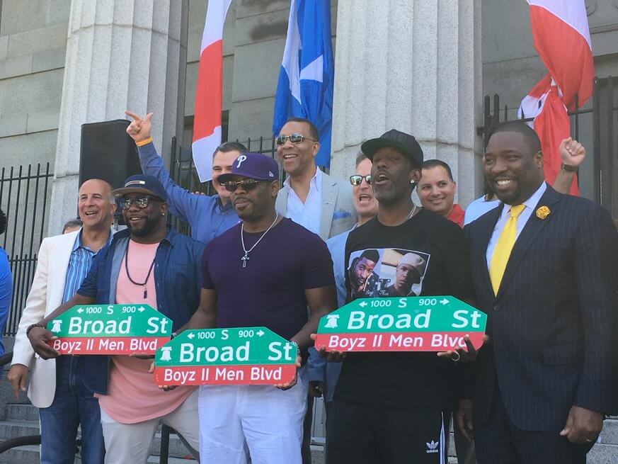 Boyz II Men poses with signs for Boyz II Men Boulevard, located on Broad Street between Carpenter and Christina Streets. | Provided