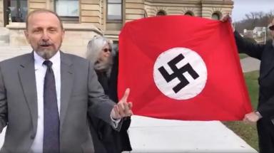 Anti-racist activist on Confederate-Nazi flag burning tour