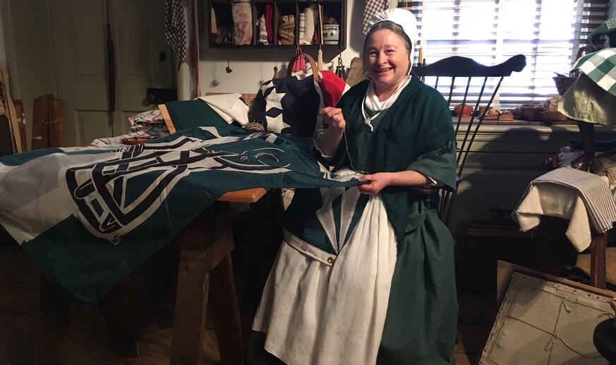 Betsy Ross works on a Philadelphia Eagles flag to fly outside her home. | Jennifer Logue