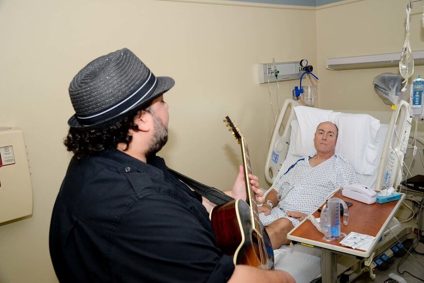 Mutlu performs for a patient with the WXPN Musicians On Call program. | Provided