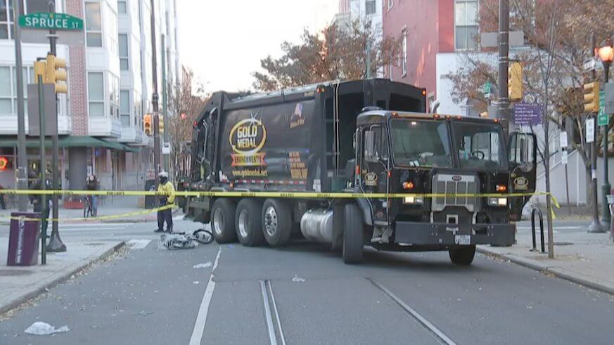 The scene after a garbage truck hit and killed a cyclist at Spruce and 11th Streets in November. The city is weighing putting the bike lane on the other side of the street. (Courtesy of the Mayor's Office of Transportation and Infrastructure Systems/oTIS)