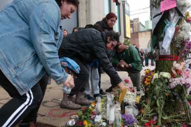 Friends and family of Pablo Avendano, the Caviar bike courier killed by a SUV on May 12, gathered to install a 'Ghost Bike' memorial at 10th and Spring Garden where he died. (Kait Moore)