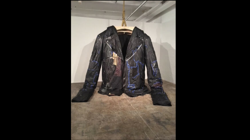 Ursula von Rydingsvard's PODERWAĆ is a giant leather jacket on display at the Fabric Museum and Workshop. | Jennifer Logue