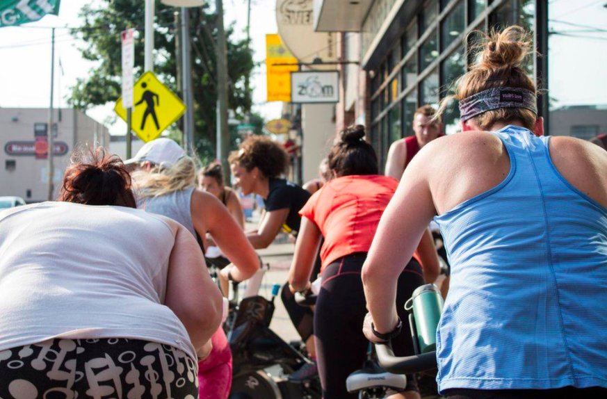 This SWEAT Fitness cycling class is outdoors and includes a happy hour. | Provided