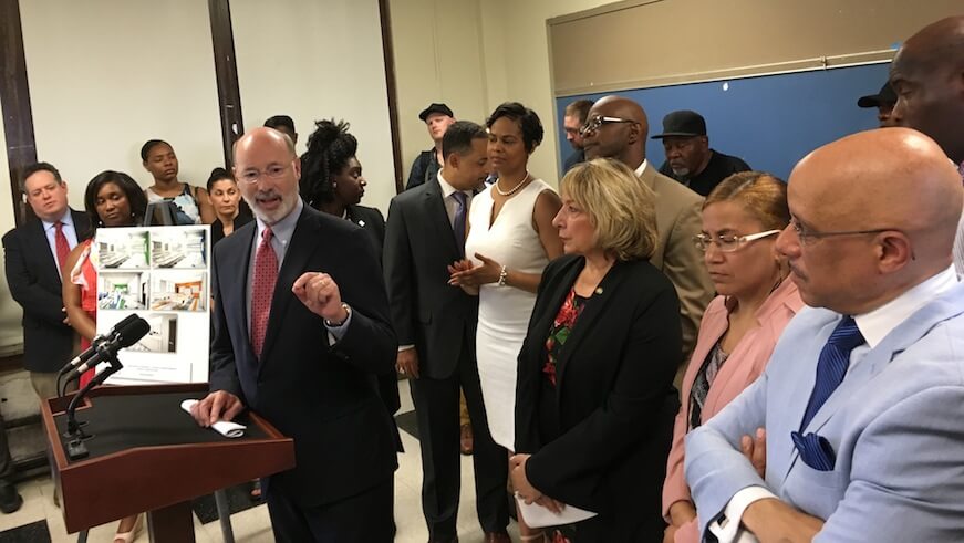 Gov. Tom Wolf is seen in June announcing new funding to help Philly schools clean up damaged lead paint and plaster.