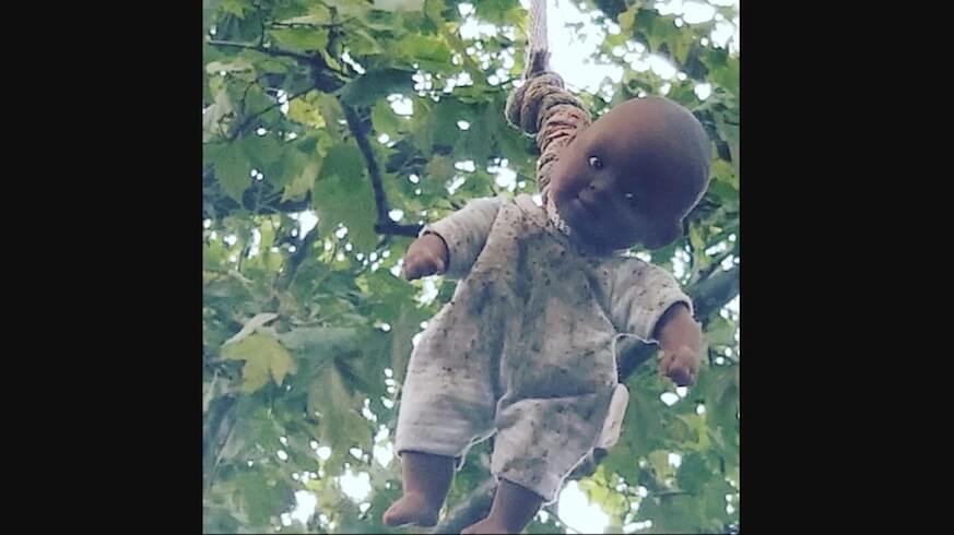 Group of boys take responsibility for hung black baby doll over historic
