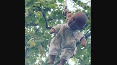 Group of boys take responsibility for hung black baby doll over historic