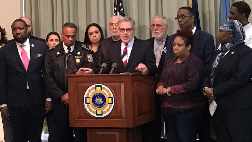 Philly DA Larry Krasner, at podium, announces he will begin enforcing a city ordinance requiring lost or stolen guns to be reported, despite the NRA blocking it from enforcement for the past decade. (Sam Newhouse)