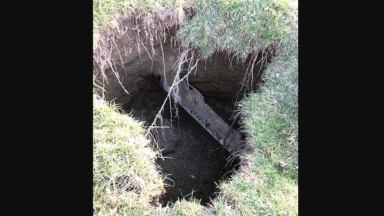 A new sinkhole in West Whiteland Township, Pa., appeared on Jan. 20, and was promptly guarded by private security identifying themselves as law enforcement, Chesco DA Tom Hogan says. (Courtesy of Chesco DA)