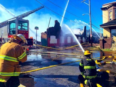 Over 100 firefighters battle West Philly auto body blaze