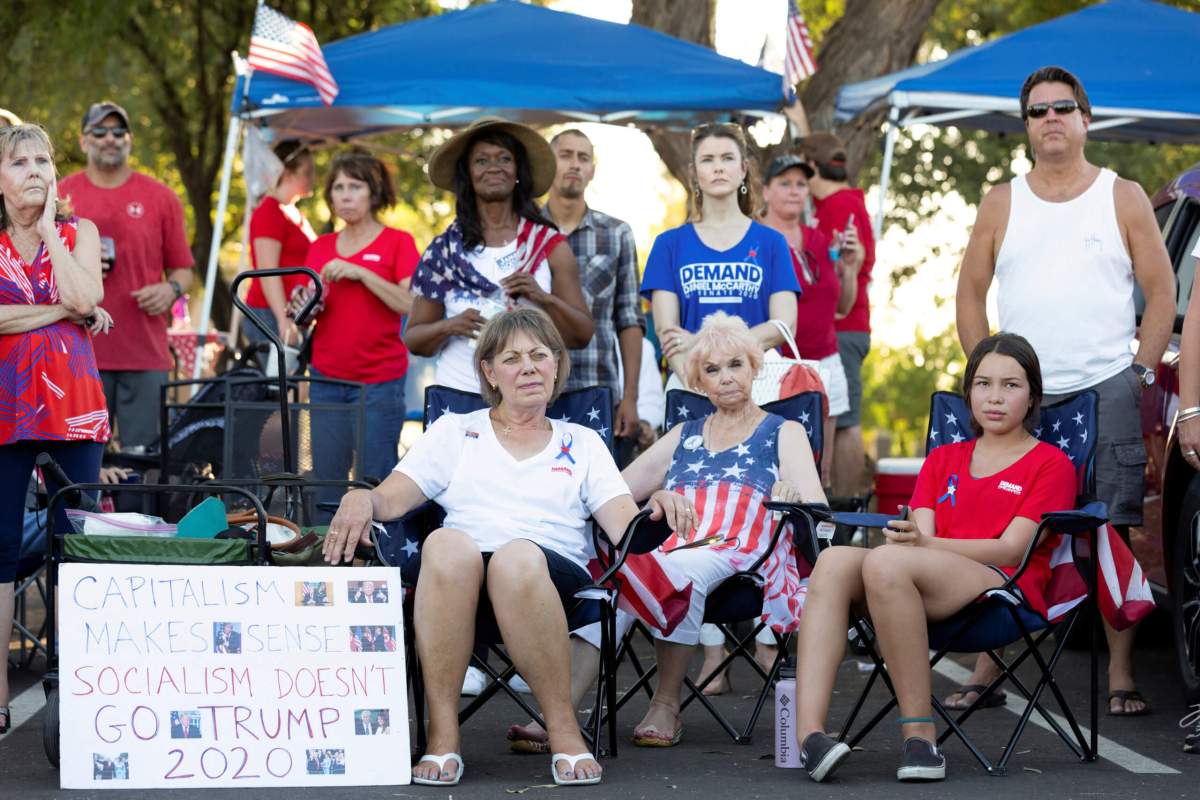 People take part in a protest against restrictions to prevent the spread of the coronavirus disease (COVID-19), in Phoenix