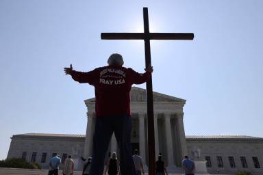 Demonstrators gather outside the U.S. Supreme Court in Washington