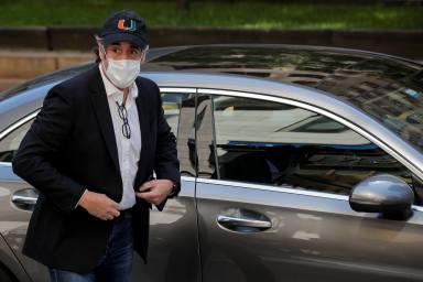 Michael Cohen, the former personal lawyer for U.S. President Donald Trump arrives at his Manhattan apartment after being released from federal prison to serve the remainder of his sentence under home confinement in New York