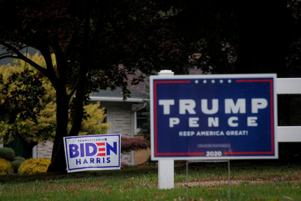 Campaign signs for U.S. President Trump and Democratic U.S. presidential nominee and former Vice President Biden are seen near an event in Erie