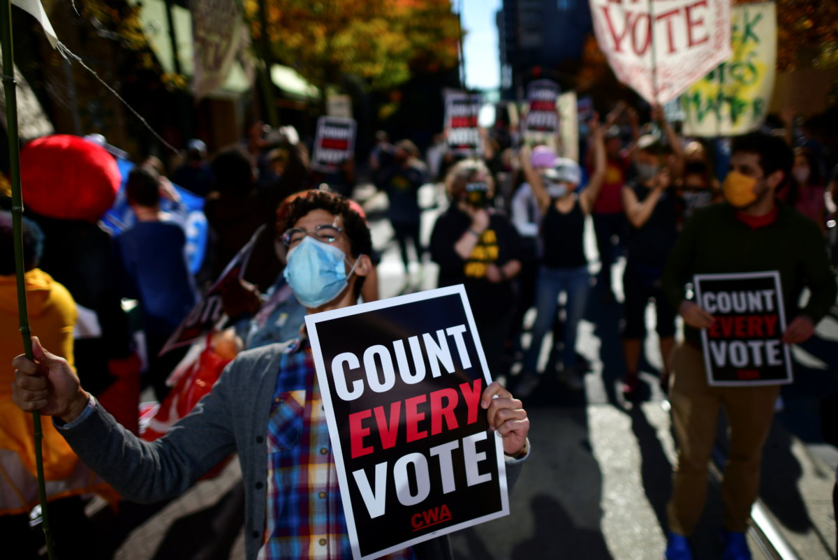 People demonstrate outside of the Philadelphia Convention Center, where votes are still being counted two days after the 2020 U.S. presidential election, in Philadelphia