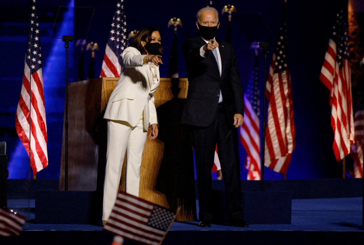 Democratic 2020 U.S. presidential nominee Joe Biden joins vice presidential nominee Kamala Harris onstage in Wilmington