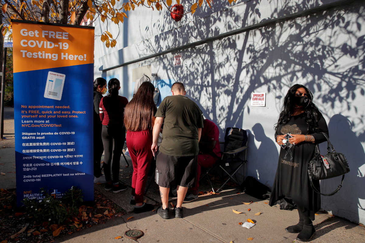 People stand in line to be tested for the coronavirus disease (COVID-19) in Staten Island, New York