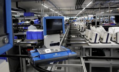 FILE PHOTO: A ventilator of Hamilton Medical AG is transported on a conveyor at a plant in Domat/Ems