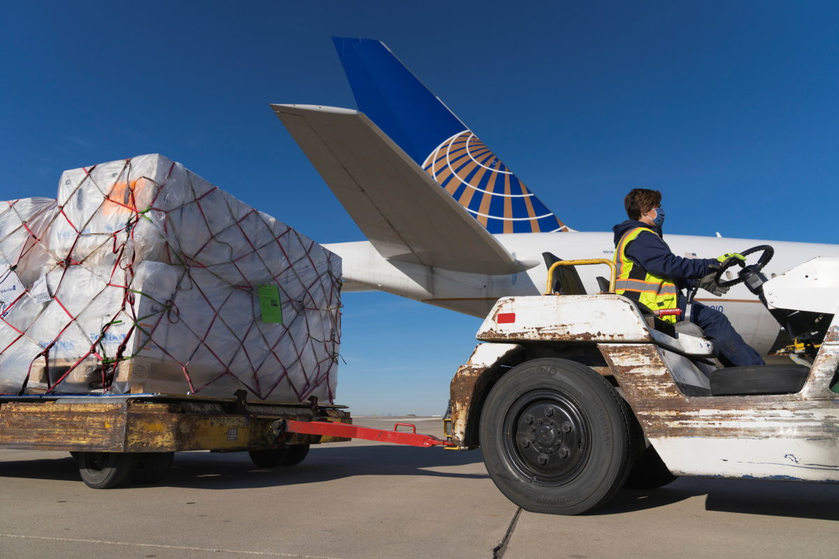 A shipment of Pfizer’s coronavirus disease vaccines is unloaded from a United Airlines cargo-only flight in Chicago