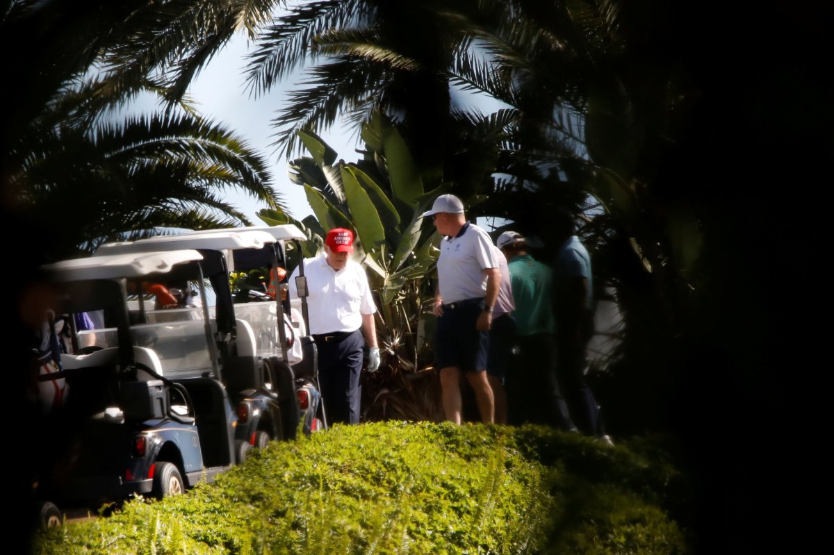 U.S. President Donald Trump plays golf at the Trump International Golf Club in West Palm Beach