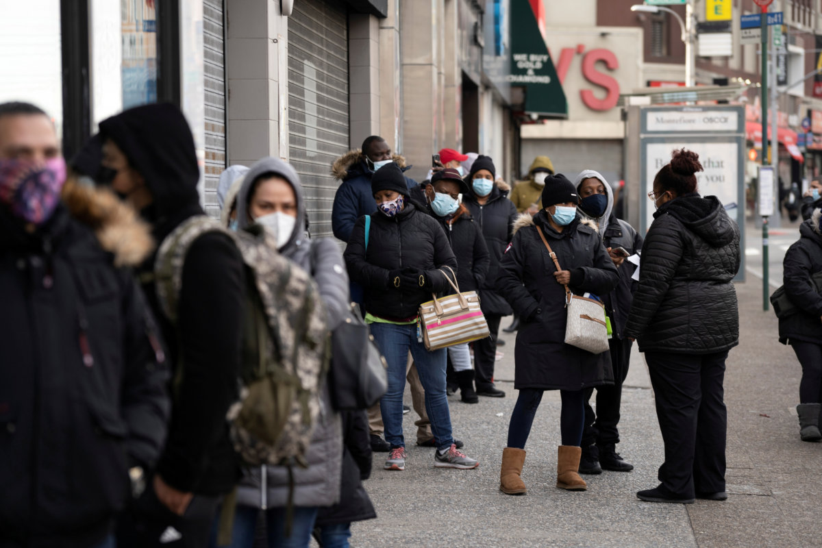 FILE PHOTO: People wait in line to get tested for the coronavirus disease (COVID-19) in the Bronx