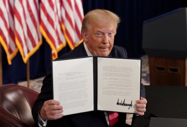 FILE PHOTO: U.S. President Donald Trump holds a news conference at his golf resort in Bedminster