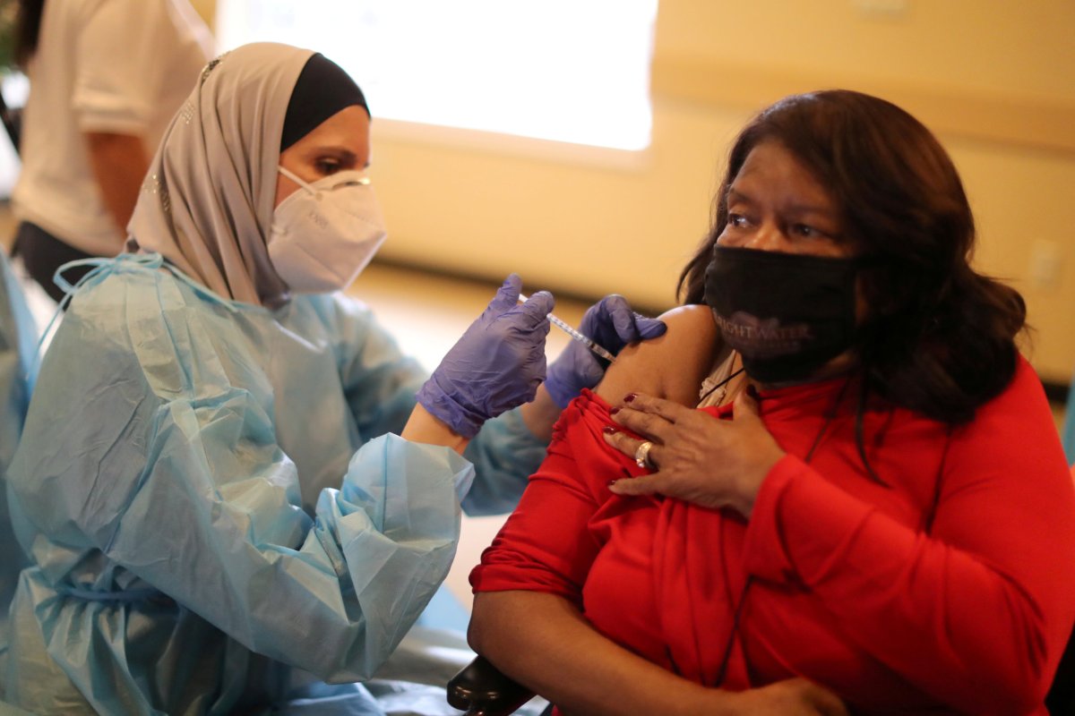 FILE PHOTO: Leona Tarver, 84, receives the coronavirus disease (COVID-19) vaccine at the Brightwater Senior Living community in Highland