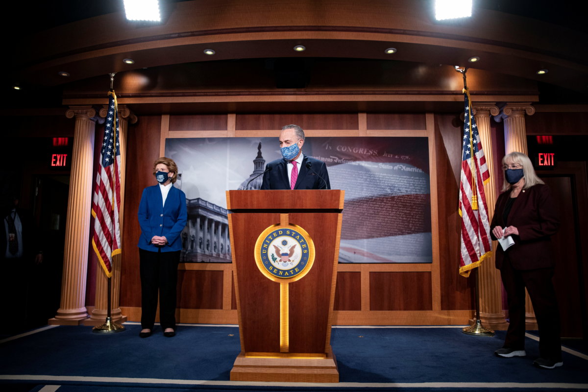 Senate Majority Leader Chuck Schumer (D-NY) speaks to the media along with Senators Debbie Stabenow (D-MI) and Patty Murray (D-WA) during a news conference