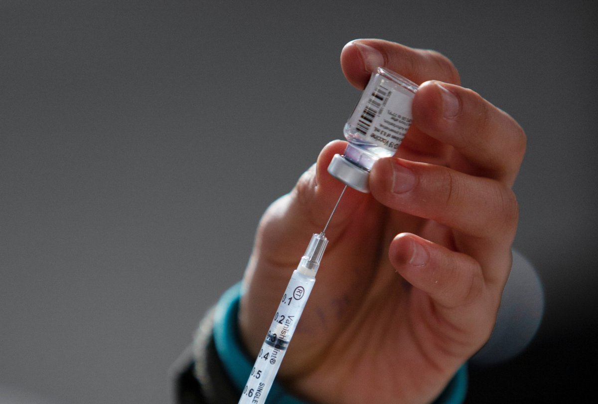 National Guard personnel guide visitors to a mass vaccination site in Ridgefield