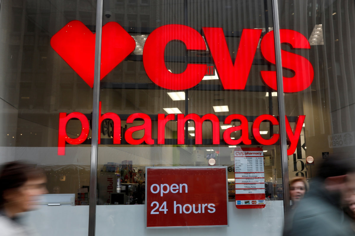 FILE PHOTO: FILE PHOTO: People walk by a CVS Pharmacy store in the Manhattan borough of New York City