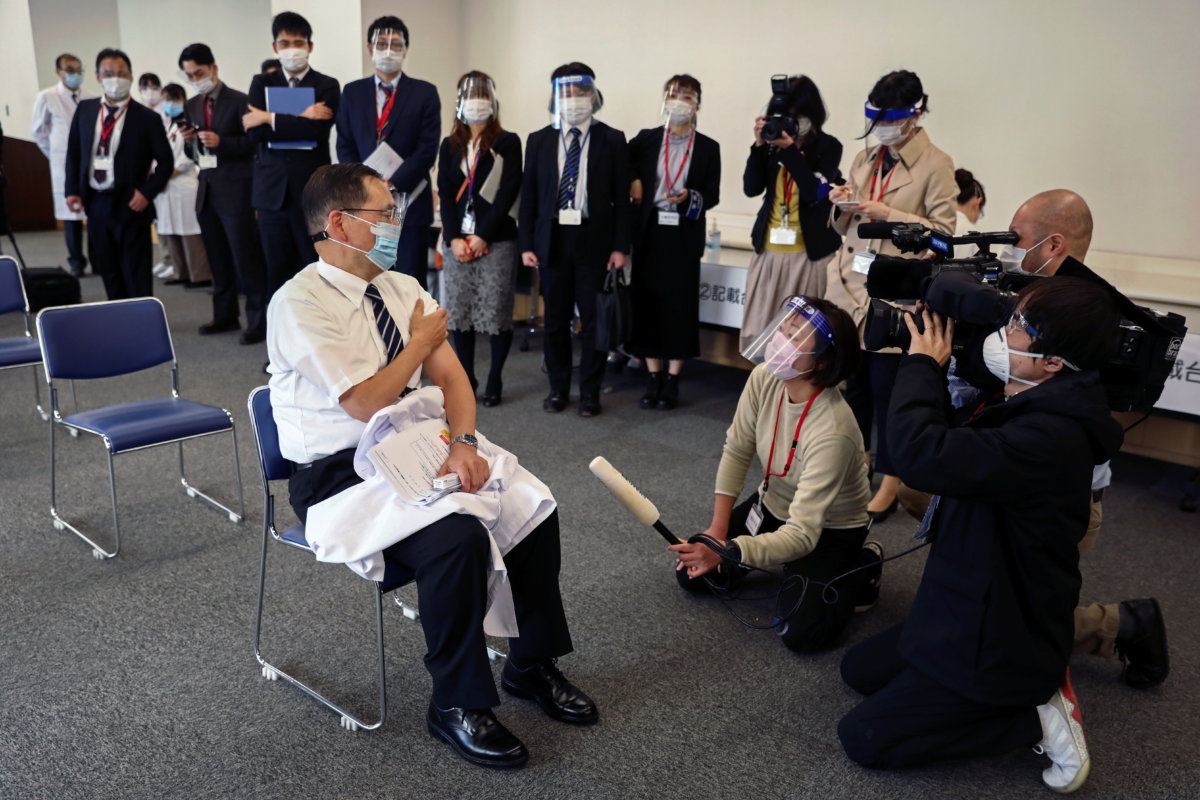 Director of the Tokyo Medical Center Kazuhiro Araki speaks to the media after receiving a dose of the coronavirus disease (COVID-19) vaccine as Japan launches its inoculation campaign, in Tokyo