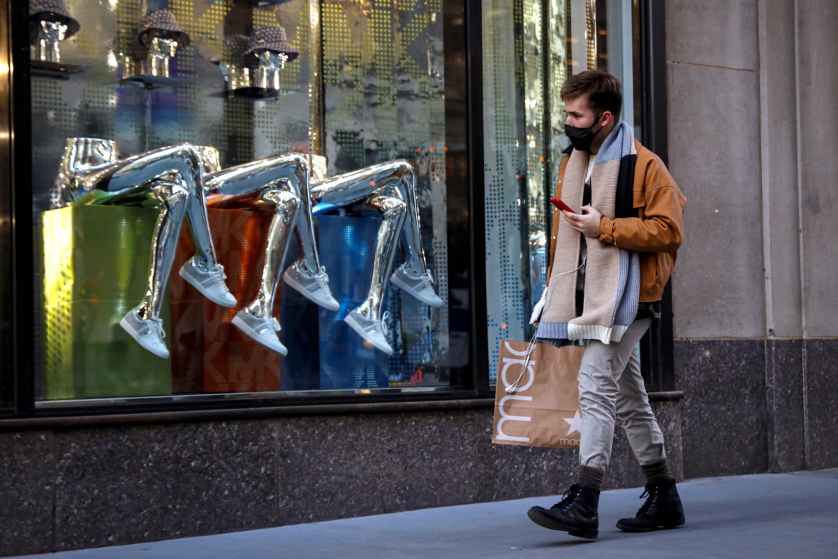 A man shops on 5th Avenue in New York