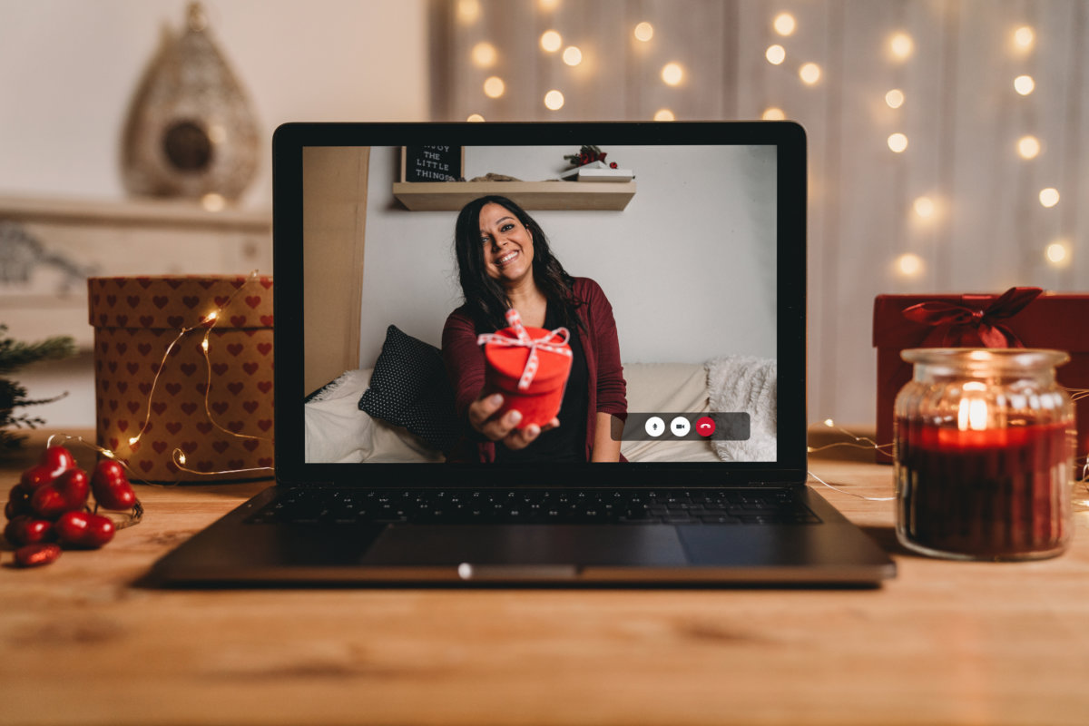 Young woman giving a present for Valentine’s day during a videocall