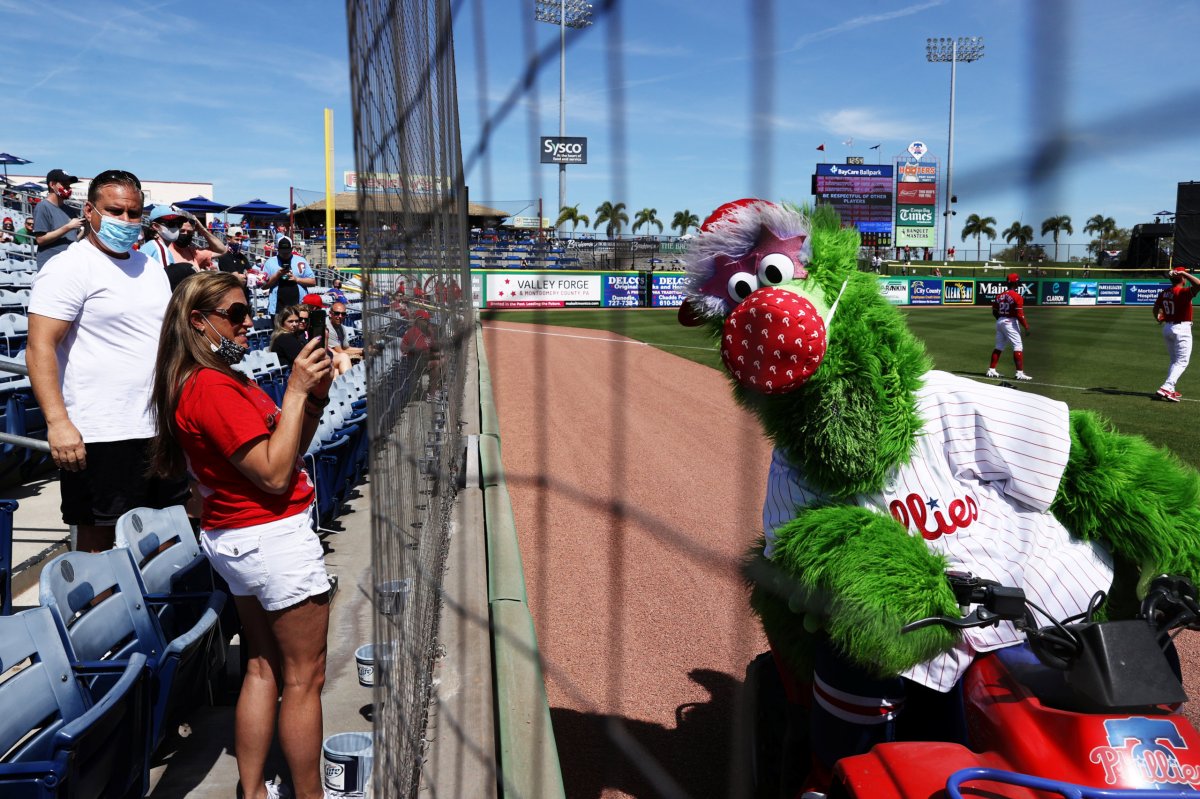 Fans enjoy a warm, sunny day during a spring training baseball game between the Pittsburgh Pirates and the Philadelphia Phillies in Clearwater, Florida