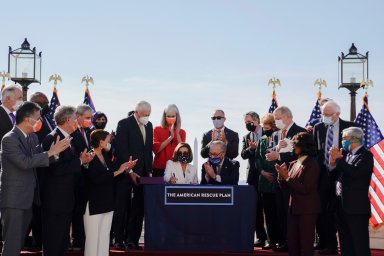 House Speaker Pelosi hosts enrolment signing ceremony for the coronavirus disease (COVID-19) relief bill on Capitol Hill in Washington