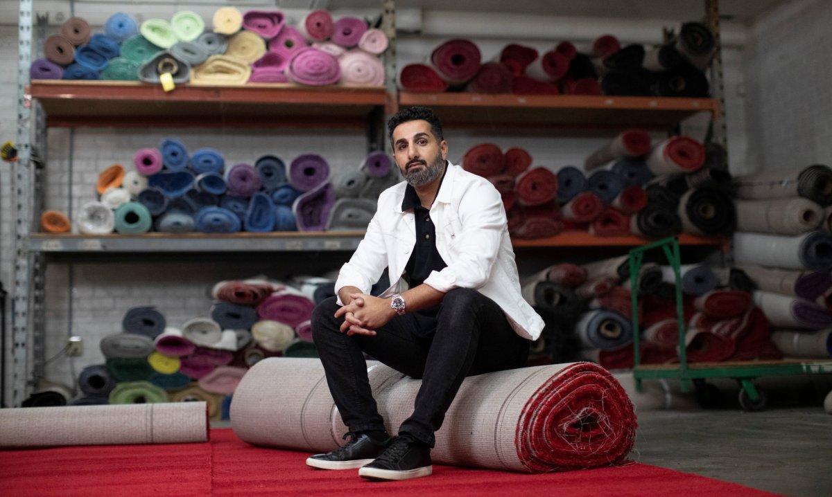 Toni Kilicoglu, owner of Red Carpet Systems, poses for a photo in his warehouse during the outbreak of the coronavirus disease (COVID-19), in Los Angeles