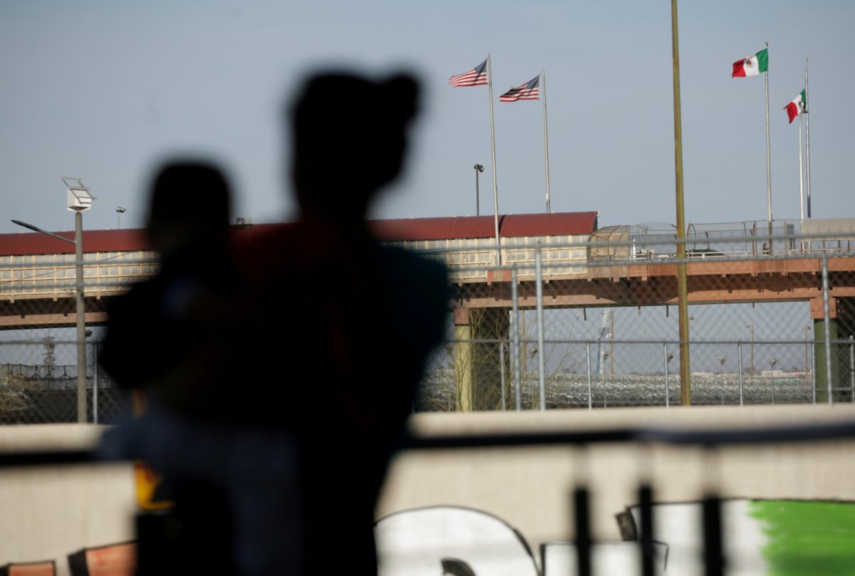 FILE PHOTO: Asylum-seeking migrants from Central America, who were airlifted from McAllen to El Paso, Texas, and deported from the U.S., in Ciudad Juarez