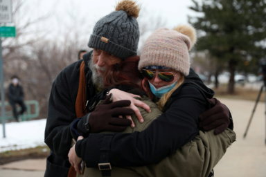 Sarah Moonshadow is comforted by David and Maggie Talley after Moonshadow was inside King Soopers grocery store during a shooting in Boulder