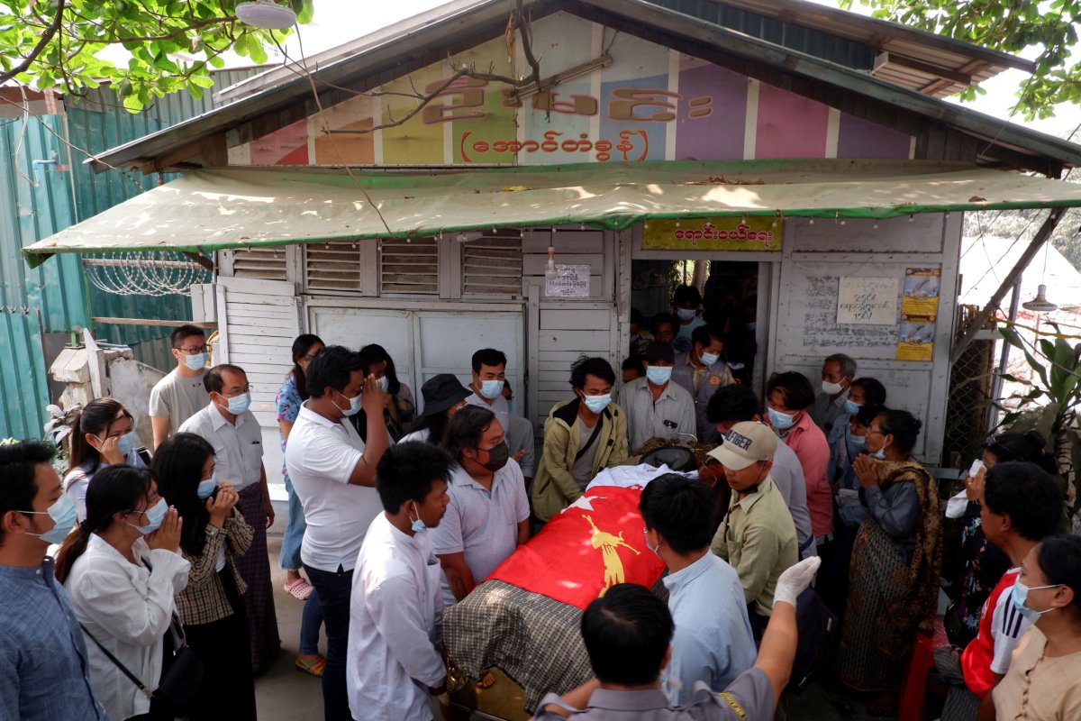 People attend the funeral of Kyaw Win Maung, who was shot and killed during a protest against the military coup, in Mandalay