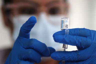 FILE PHOTO: A nurse draws from a vial of Johnson & Johnson coronavirus disease (COVID-19) vaccine, in Los Angeles