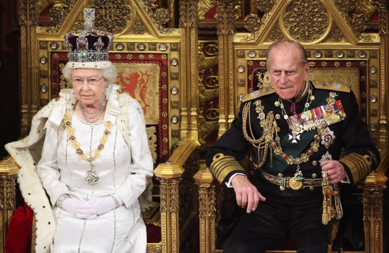 FILE PHOTO: Britain’s Queen Elizabeth waits to read the Queen’s Speech to lawmakers in the House of Lords during the State Opening of Parliament in London