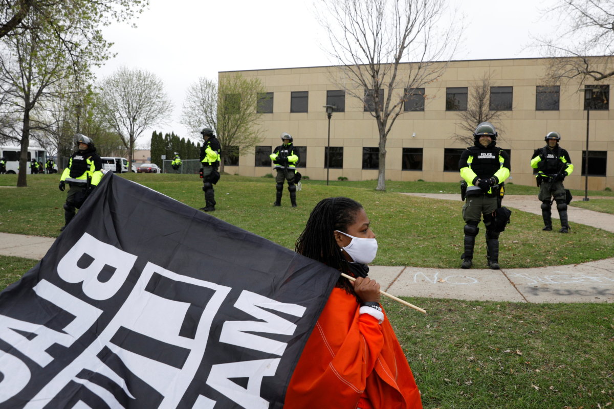 Demonstrators confront police following an officer-involved killing in Brooklyn Center, Minnesota